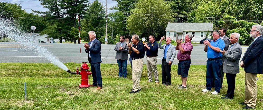 Rensselaer County Executive Steve McLaughlin opens one of the new hydrants as part of the Schodack Rte. 9 South Water Infrastructure Extension opening ceremony