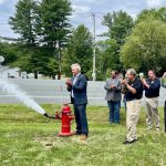 Rensselaer County Executive Steve McLaughlin opens one of the new hydrants as part of the Schodack Rte. 9 South Water Infrastructure Extension opening ceremony