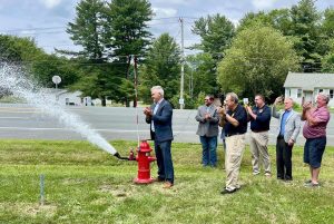 Rensselaer County Executive Steve McLaughlin opens one of the new hydrants as part of the Schodack Rte. 9 South Water Infrastructure Extension opening ceremony