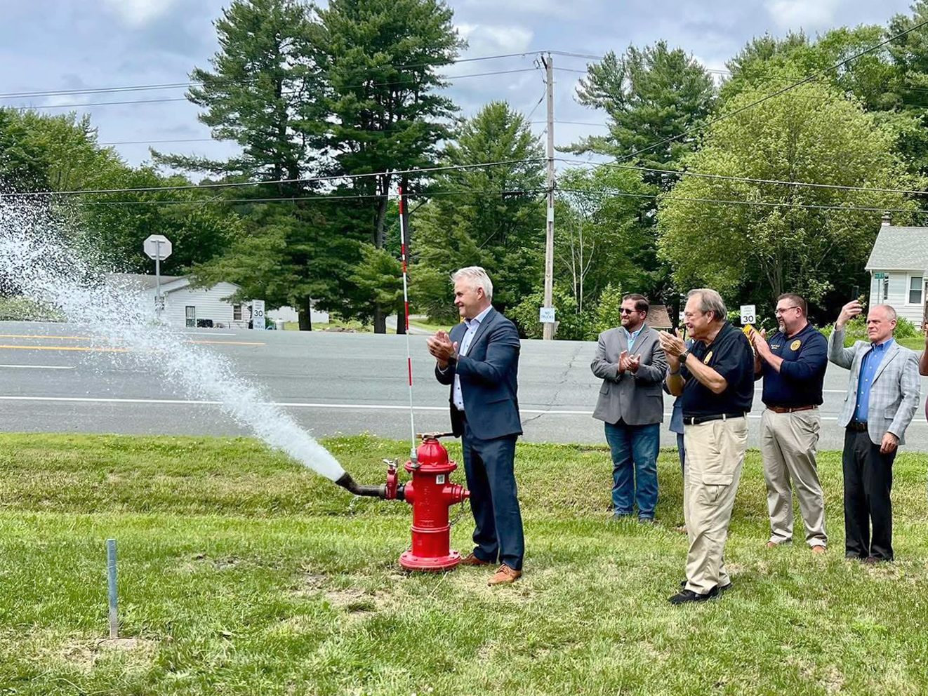 ProvidedbyRCoLegislators Rensselaer County Executive Steve McLaughlin opens one of the new hydrants as part of the Schodack Rte. 9 South Water Infrastructure Extension opening ceremony